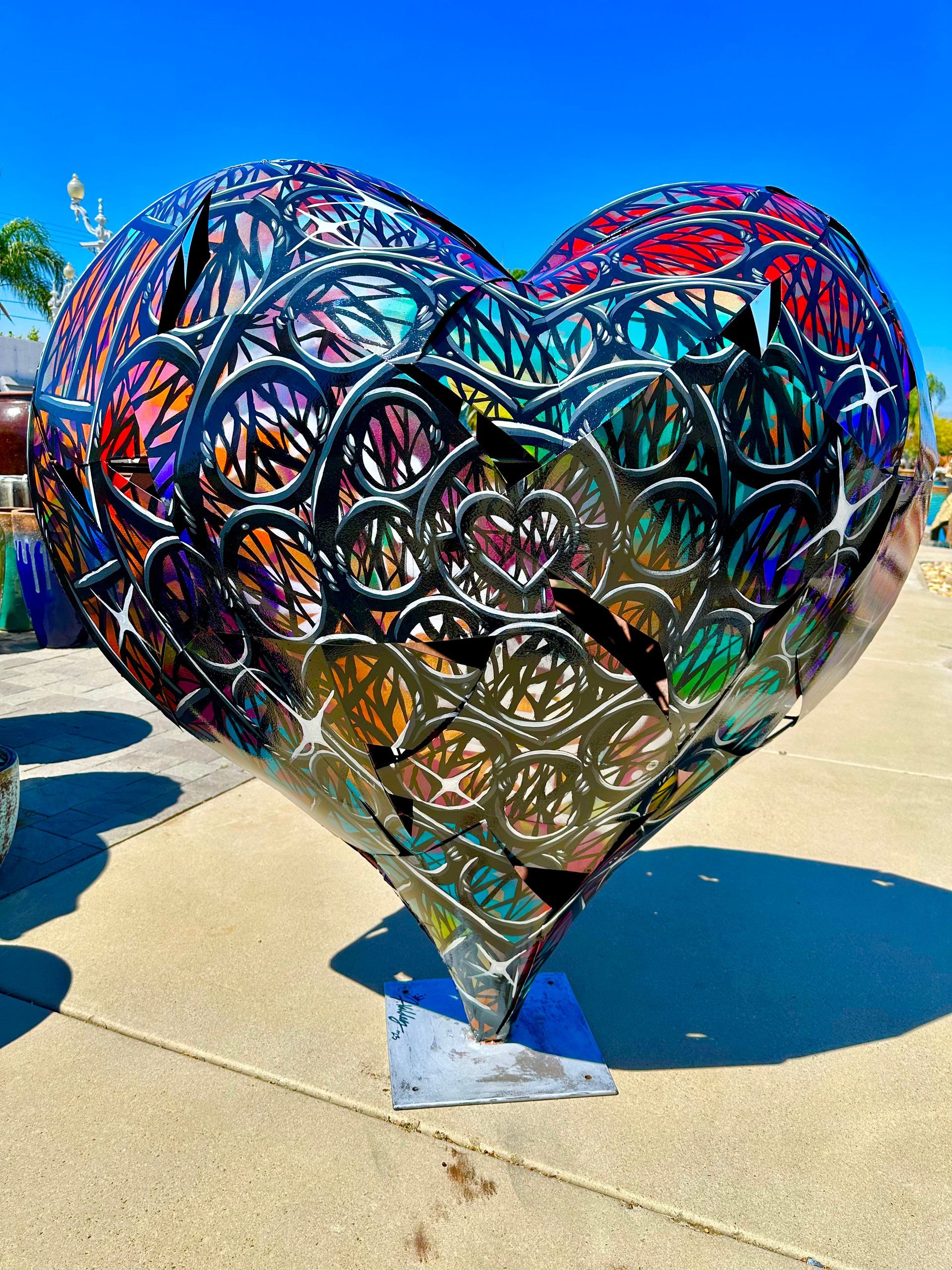 Colorful openwork metal heart sculpture