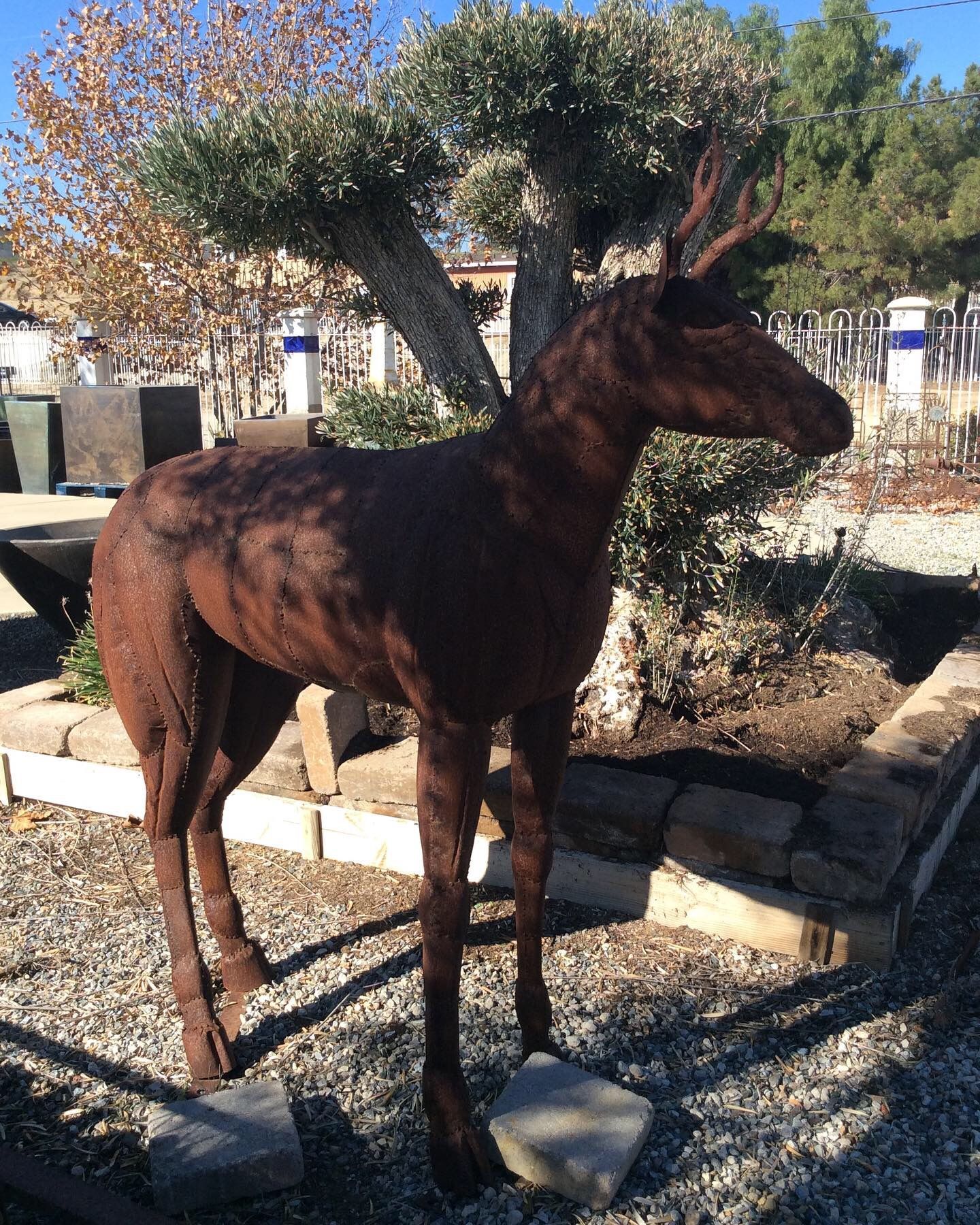 Life-size recycled metal moose sculpture